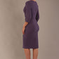 model wearing diva pencil dress tulip design with overlapping pencil skirt with 3 4 sleeves in colour dark mauve back (Mauve)