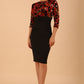 Model wearing the Diva Chiltern Print dress with round neckline in autumnal print front image