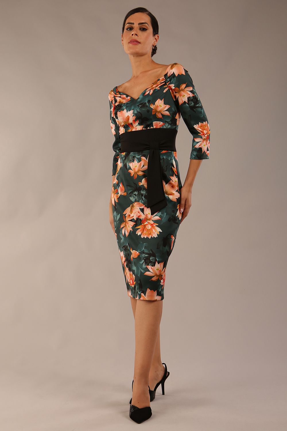 model wears Alpa Print off the shoulder pencil sheath Dress with long sleeves front image in waterlily print