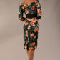 model wears Alpa Print off the shoulder pencil sheath Dress with long sleeves back image in waterlily print