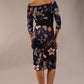 model wears Alpa Print off the shoulder pencil sheath Dress with long sleeves back image in wildflower print