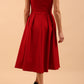 Model wearing the Diva Chesterton Sleeveless dress with oversized collar detail and swing pleated skirt in dark red back image