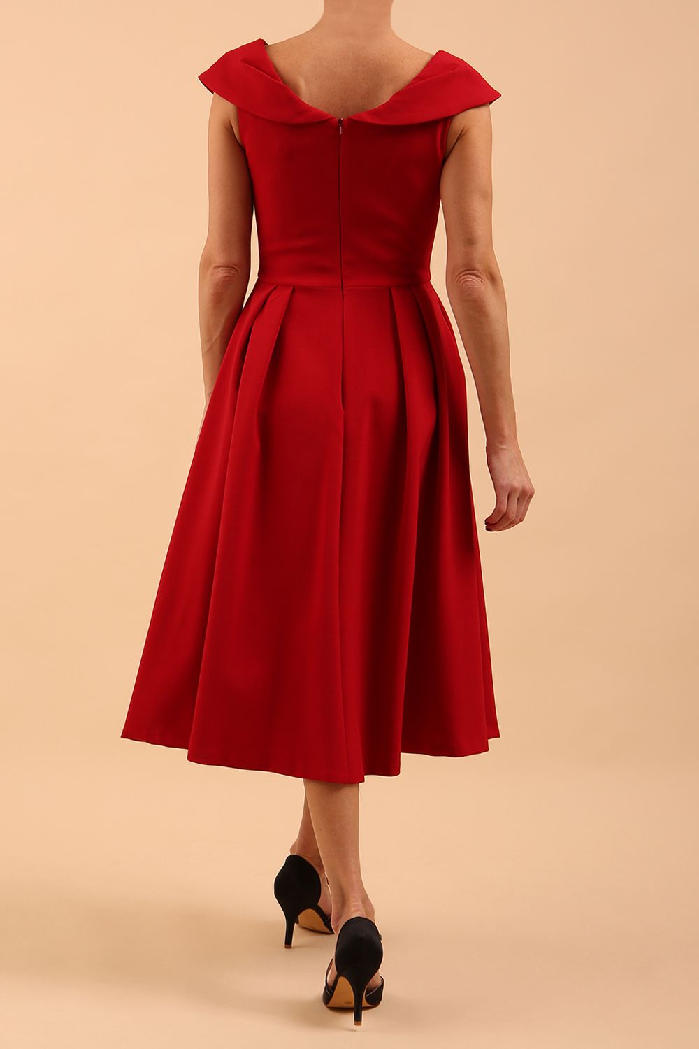 Model wearing the Diva Chesterton Sleeveless dress with oversized collar detail and swing pleated skirt in dark red back image