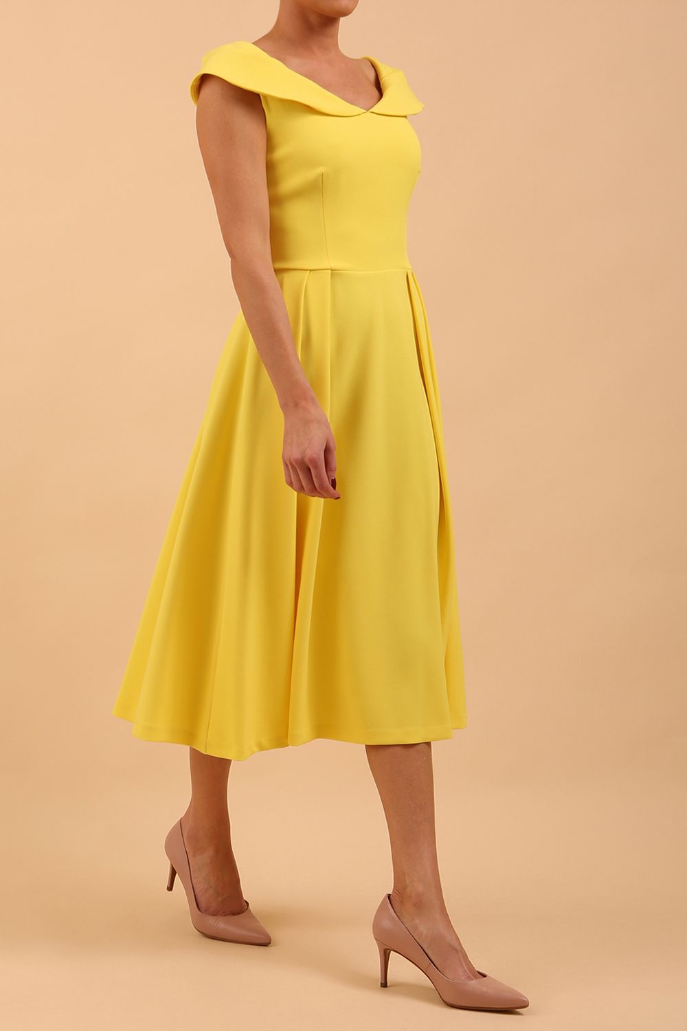 model is wearing divacatwalk Chesterton Sleeveless a-line swing dress in blazing yellow with oversized collar front