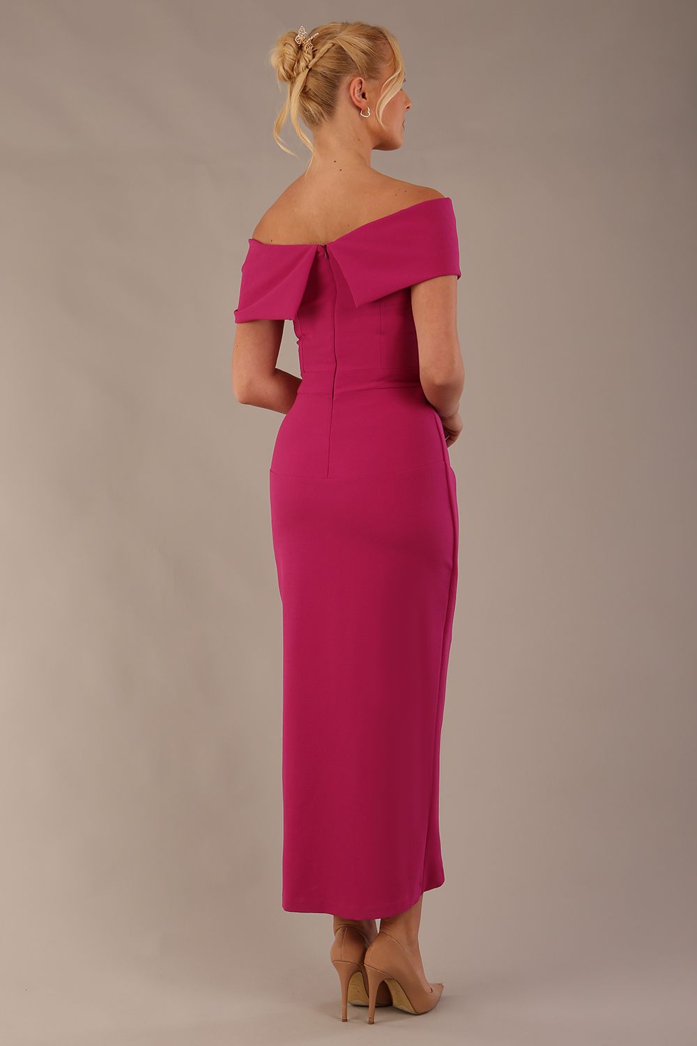 model wearing diva catwalk vegas calf length magenta midaxi dress with wide bardot neckline and open shoulders with a large opening at the front of the skirt with pleating coming down long skirt back (Magenta)