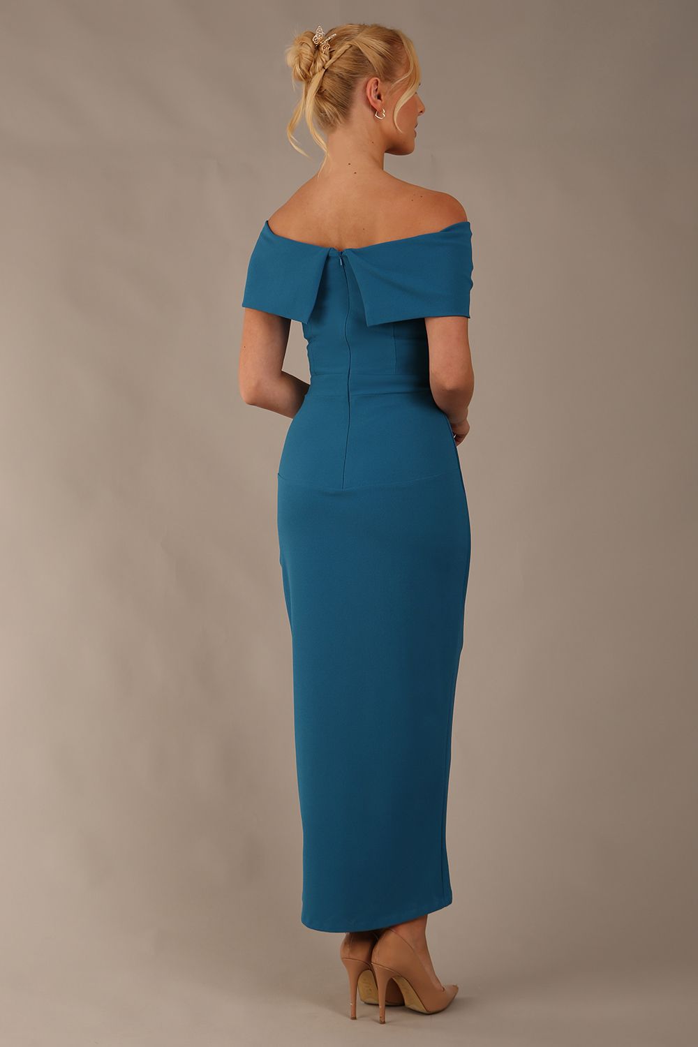 model wearing diva catwalk vegas calf length Teal midaxi dress with wide bardot neckline and open shoulders with a large opening at the front of the skirt with pleating coming down long skirt back (Tropical Teal)
