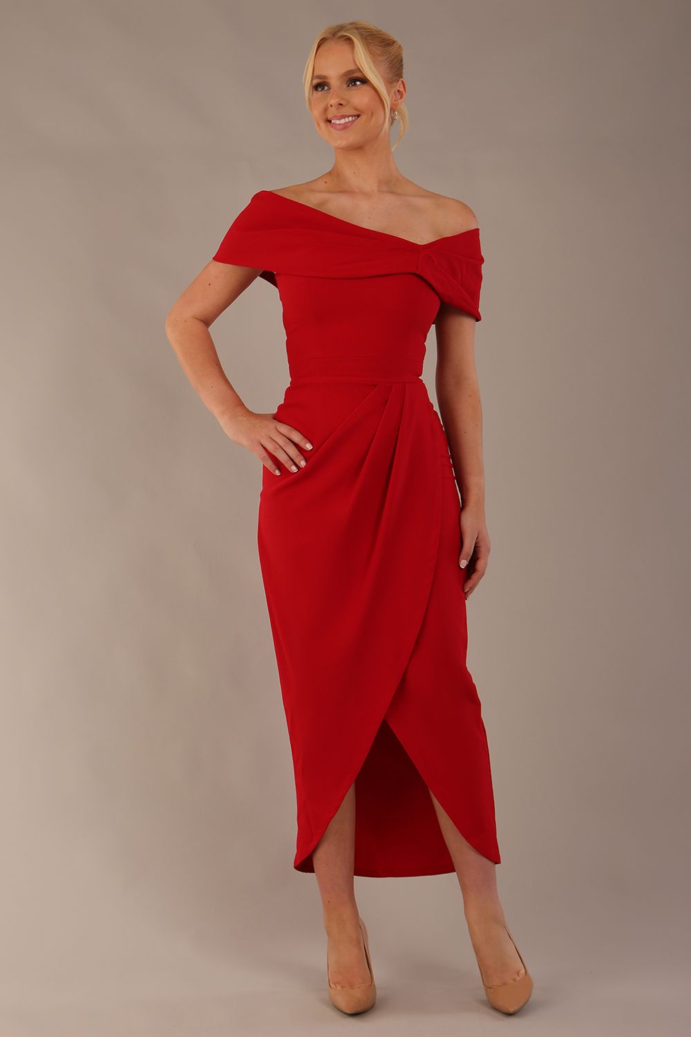model wearing diva catwalk vegas calf length midaxi dress with wide bardot neckline and open shoulders with a large opening at the front of the skirt with pleating coming down long skirt front in scarlet red (Scarlet Red)