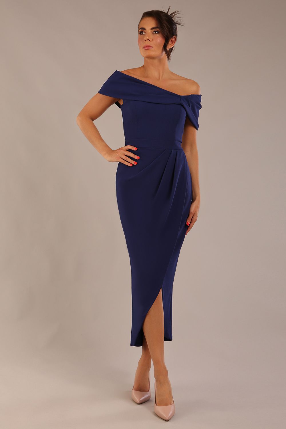 brunette model wearing diva catwalk vegas calf length navy blue midaxi dress with wide bardot neckline and open shoulders with a large opening at the front of the skirt with pleating coming down long skirt front (Navy Blue)