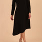 model is wearing diva catwalk dartington asymmetric skirt midaxi long sleeve dress with rounded pleated neckline a-line style in black front