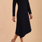 model is wearing diva catwalk dartington asymmetric skirt midaxi long sleeve dress with rounded pleated neckline a-line style in navy blue  side