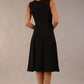 model wearing Diva Catwalk Patina A-line Swing Sleeveless dress with v-neckline with butterfly detail in Black back