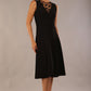 model wearing Diva Catwalk Patina A-line Swing Sleeveless dress with v-neckline with butterfly detail in Black front