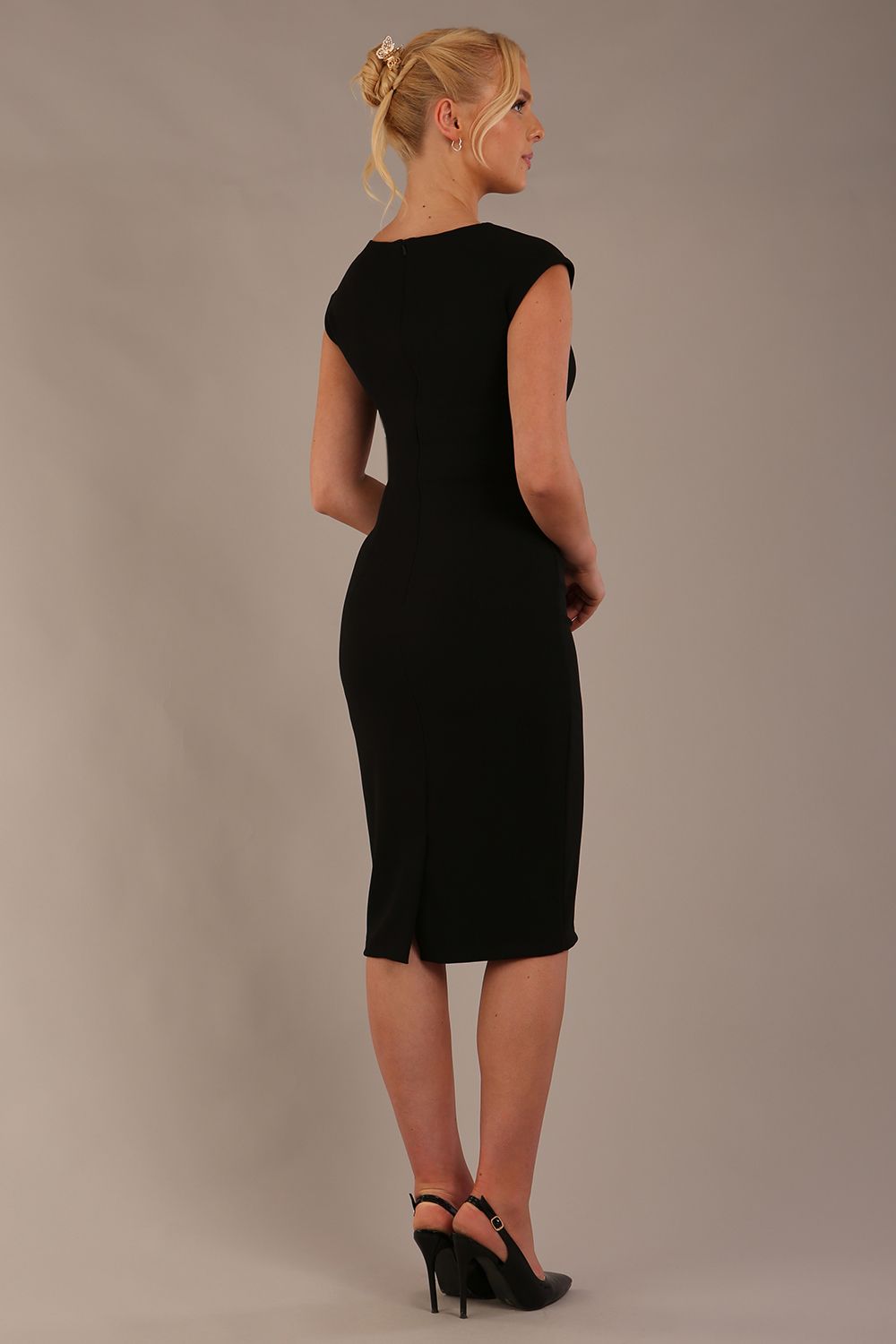 model wearing diva catwalk lydia sleeveless pencil flattering fitted plain dress with split neckline and pleating across the body black back (Black)