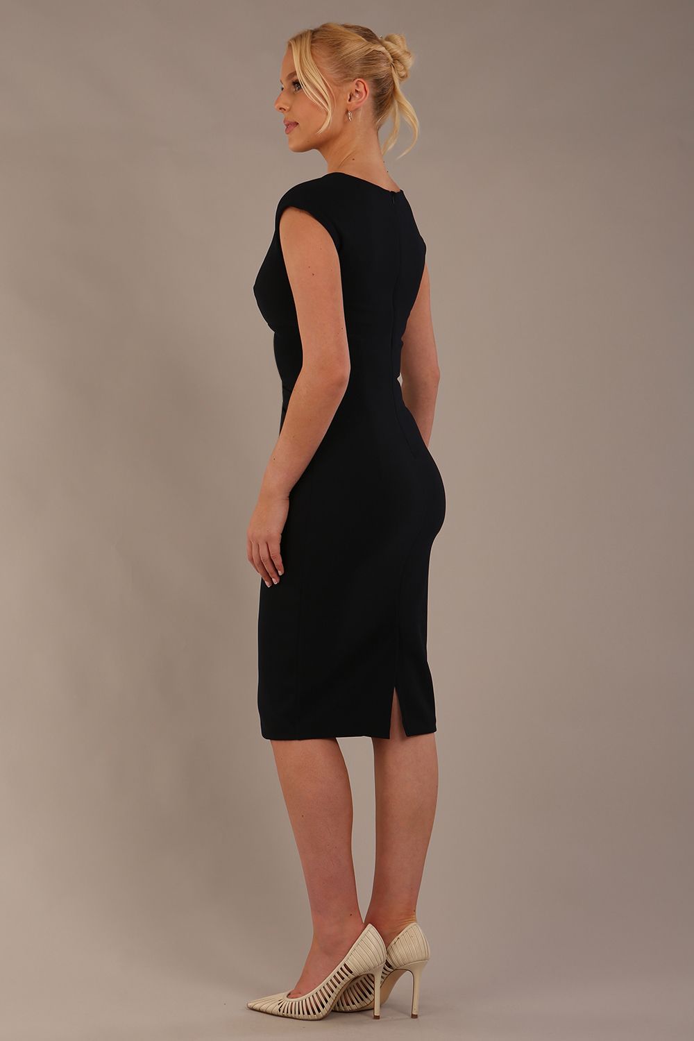model wearing diva catwalk lydia sleeveless pencil flattering fitted plain dress with split neckline and pleating across the body Midnight Blue front (Midnight Blue)