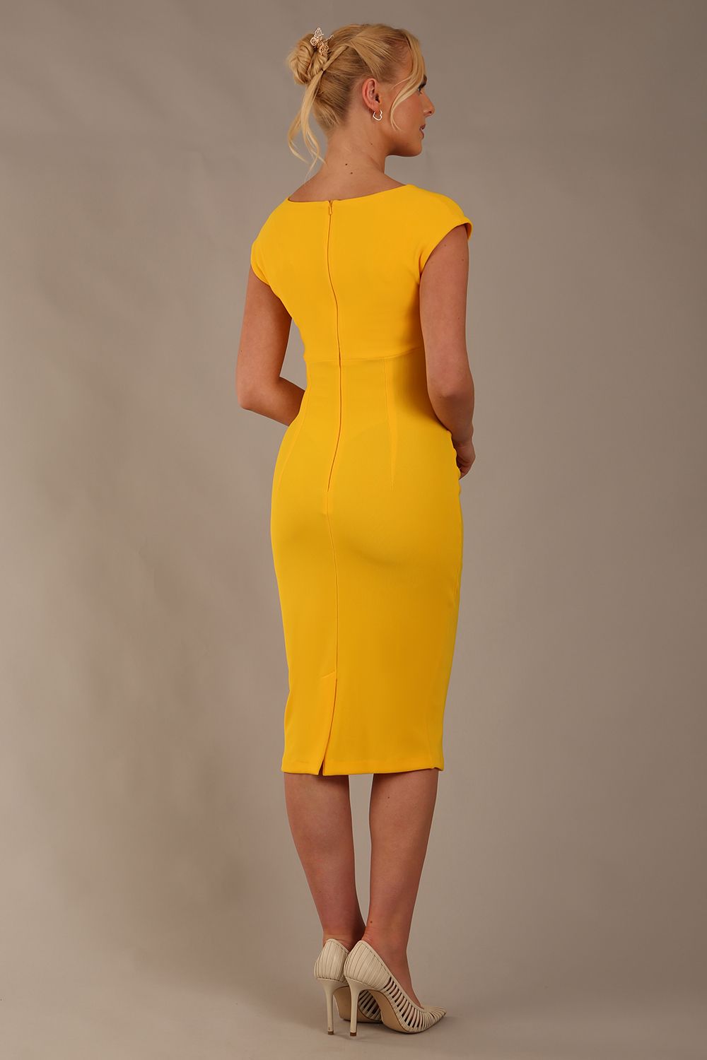 model wearing diva catwalk lydia sleeveless pencil flattering fitted plain dress with split neckline and pleating across the body in spectra yellow back (Spectra Yellow)