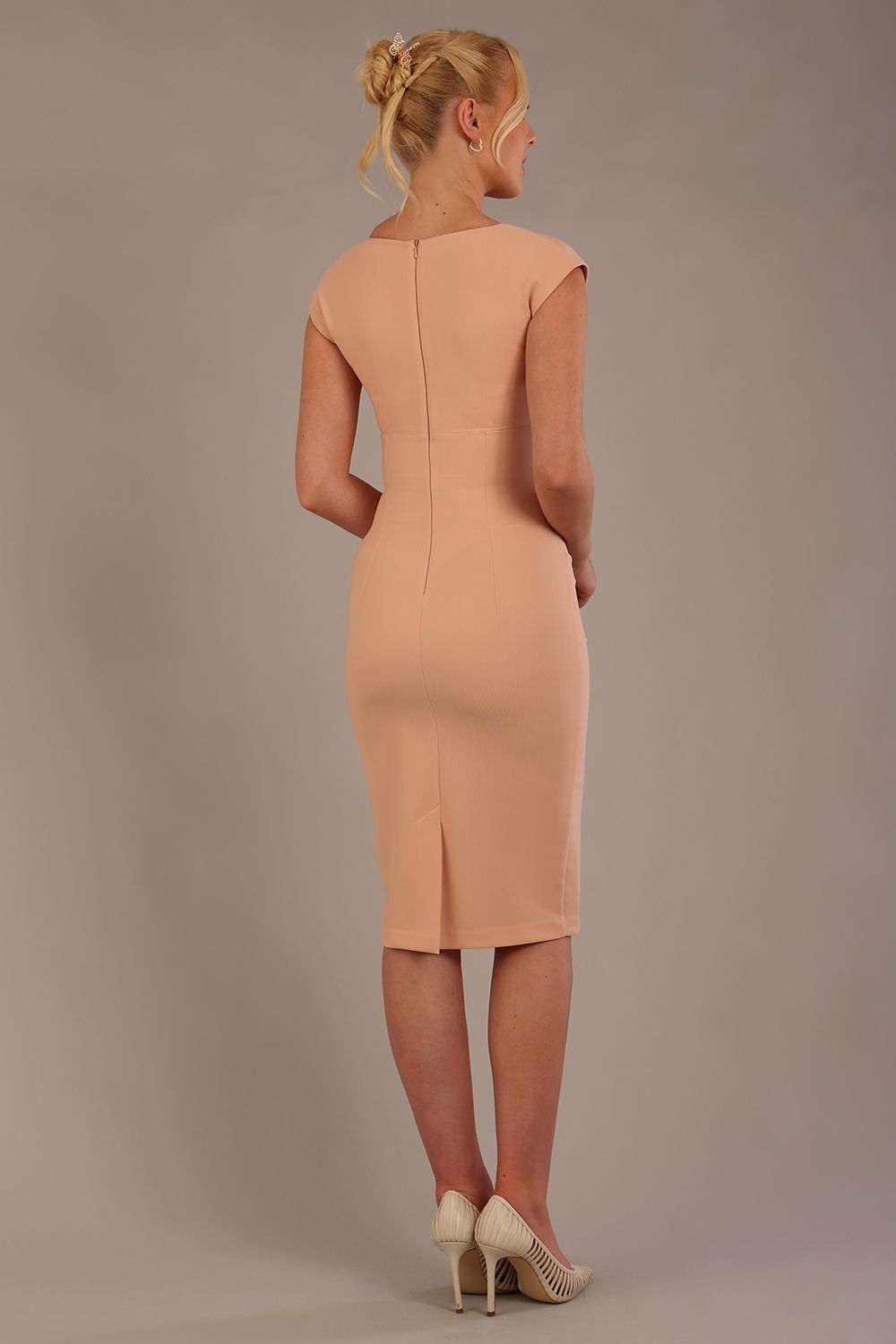 model wearing diva catwalk lydia sleeveless pencil flattering fitted plain dress with split neckline and pleating across the body in almond mousse sheath dress back (Almond Mousse)