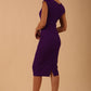 brunette model wearing diva catwalk lydia sleeveless pencil flattering fitted plain dress with split neckline and pleating across the body passion purple