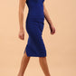 brunette model wearing diva catwalk lydia sleeveless pencil flattering fitted plain dress with split neckline and pleating across the body cobalt blue 
