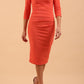 model wearing Diva Catwalk pencil three quarter sleeve dress with a split neckline and pleating across the tummy in sea coral front