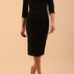 model wearing Diva Catwalk pencil three quarter sleeve dress with a split neckline and pleating across the tummy in black front