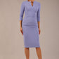 brunette model wearing a Diva Catwalk pencil three quarter sleeve dress with a split neckline and pleating across the tummy and round neck in vista blue colour front