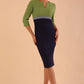 brunette model wearing seed lara pencil colour block dress three quarter sleeve and pleating across the body with split neckline in navy blue and citrus green and sky grey front