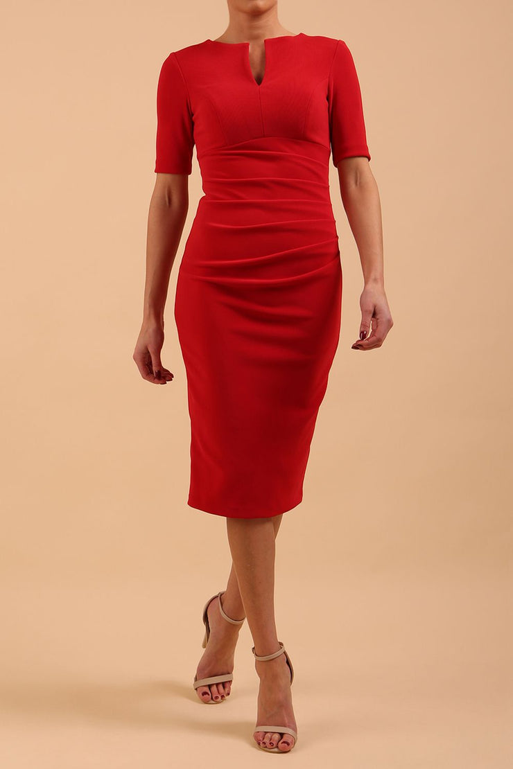 model is wearing Diva Catwalk Lydia Short Sleeve Pencil Dress with pleating across the tummy and split neckline in True Red front