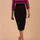 A model is wearing a three quarter sleeve colour block pencil dress by Diva Catwalk in Black and Dawn Purple colour