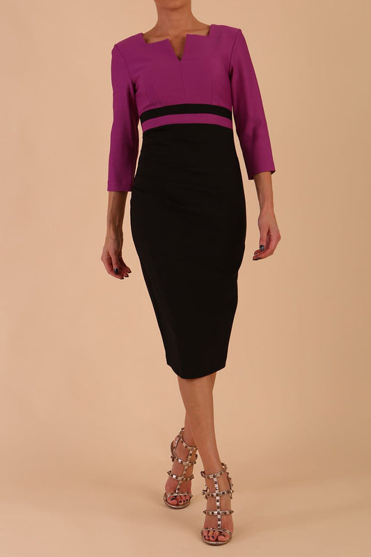 A model is wearing a three quarter sleeve colour block pencil dress by Diva Catwalk in Black and Dawn Purple colour