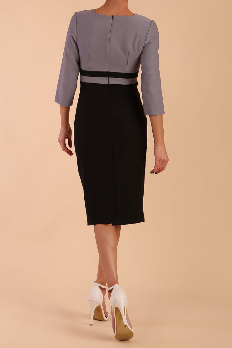 A model is wearing a three quarter sleeve colour block pencil dress by Diva Catwalk in Black and Sky Grey colour
