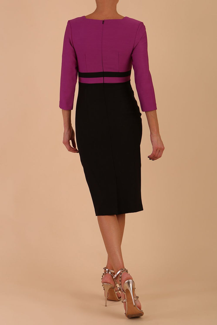 A model is wearing a three quarter sleeve colour block pencil dress by Diva Catwalk in Black and Dawn Purple colour back