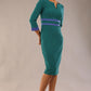 Model wearing Diva catwalk Paeonia dress square neckline with a vent in Pacific Green with Thistle Blue and Pacific Green stripes around the waist and three quarter sleeve with Thistle Blue contrast finish front side