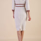 brunette model wearing Diva catwalk Paeonia dress square neckline with a vent in sandshell beige with Acorn Brown and sandshell beige stripes around the waist and three quarter sleeve with Acorn Brown contrast finish back