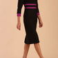 brunette model wearing Diva catwalk Paeonia dress square neckline with a vent in black with dawn purple and black stripes around the waist and three quarter sleeve with dawn purple contrast finish front
