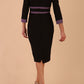 brunette model wearing Diva catwalk Paeonia dress square neckline with a vent in black with Dusky Lilac and black stripes around the waist and three quarter sleeve with Dusky Lilac contrast finish back