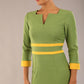 Model wearing Diva catwalk Paeonia dress square neckline with a vent in Citrus Green with Daffodil Yellow and Citrus Green stripes around the waist and three quarter sleeve with Daffodil Yellow contrast finish front close up