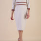 brunette model wearing Diva catwalk Paeonia dress square neckline with a vent in sandshell beige with Acorn Brown and sandshell beige stripes around the waist and three quarter sleeve with Acorn Brown contrast finish front