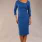 Model wearing Diva catwalk Opulus pencil dress in sapphire blue with three quarter sleeve figure fitted front image