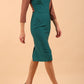 Model wearing Diva catwalk Katykat pencil figure fitted dress in pacific green and acorn brown detail with three quarter sleeve front image