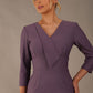 model wearing diva catwalk cranston pencil-skirt dress with low v-neck and tie detail wide band with sleeves in dusty lilac colour (Dusky Lilac)