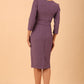 brunette model wearing diva catwalk cranston pencil-skirt dress with low v-neck and tie detail wide band with sleeves in dusty lilac colour 