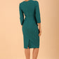 brunette model wearing diva catwalk cranston pencil-skirt dress with low v-neck and tie detail wide band with sleeves in pacific green colour back