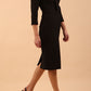 brunette model wearing diva catwalk cranston pencil-skirt dress with low v-neck and tie detail wide band with sleeves in black colour front side