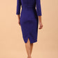 Model wearing Diva catwalk Pieris pencil dress in palace blue with three quarter sleeve figure fitted back image