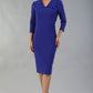 Model wearing Diva catwalk Pieris pencil dress in palace blue with three quarter sleeve figure fitted black image