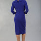 Model wearing Diva catwalk Pieris pencil dress in palace blue with three quarter sleeve figure fitted black image