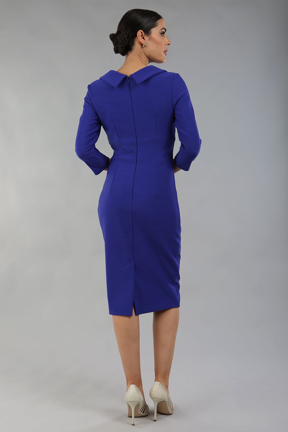 Model wearing Diva catwalk Pieris pencil dress in palace blue with three quarter sleeve figure fitted black image