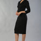 Model wearing Diva catwalk Pieris pencil dress in black with three quarter sleeve figure fitted front image