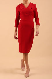 Model wearing Diva catwalk Pieris pencil dress in cardinal red with three quarter sleeve figure fitted front image