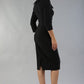 Model wearing Diva catwalk Pieris pencil dress in black with three quarter sleeve figure fitted front image